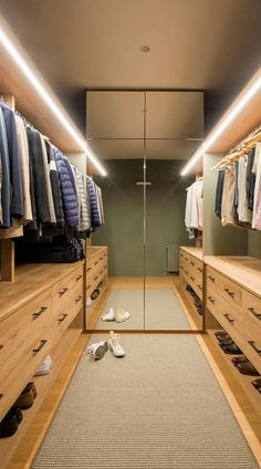 an image of a walk in closet with shoes on the floor