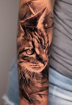 a cat with a crown on it's head is shown in this tattoo design