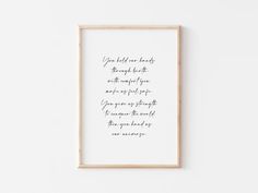 a framed print with the words you hold your hands