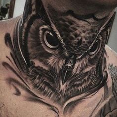 an owl tattoo is shown on the chest