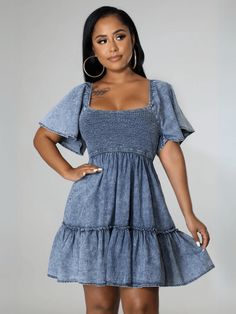 Get ready for some serious cuteness with our Sonesta Babydoll Denim Mini Dress! This light wash dress is the perfect combination of playful and stylish, with its flowy babydoll silhouette and denim fabric. Perfect for casual outings or dressed up for a night out, this dress will be a go-to in your wardrobe. Size Guide: Model is 5’6” tall, and has a 33.8” bust, 26.7” waist, & 35.5” hips. She is wearing a S / US 4 / AU 8. This dress is true to size. Material: 100% Cotton Feature: Denim Fabrication. Short Ruffle Sleeves. Square Neckline. Smocked Bodice. Mini Length. Tiered Skirt. Relaxed Babydoll Fit. Care Instructions: Machine wash / Cold hand wash Denim Tube Dress, Denim Dresses Online, Casual Denim Dress, Denim Style Casual, Dress With Ruffle Sleeves, Womens Denim Dress, Exclusive Dress, Prom Dress Shopping, Urban Dresses