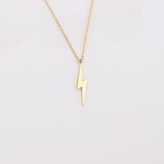 Your Lightning Bolt Necklace is stylish, dainty and pretty ideal for everyday use. Details of solid gold handmade Dainty Flash Jewelry are very eye-catching. It is a great gift for your loved ones. This jewelry will be an indispensable piece of yours. This meaningful Thunder Bolt Charm Necklace with high quality handwork will be a legacy you can leave to your family its. * Lightning Bolt Necklace Details * Material / Gold Kt : This elegant necklace is made of 14k and 18k Solid Gold * Available G Thunder Bolt, Gold Lightning, Lightning Bolt Necklace, Elegant Necklace, Elegant Necklaces, Lightning Bolt, Charm Necklace, Valentine Day Gifts, Arrow Necklace