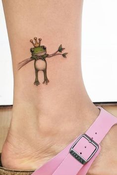 a small frog tattoo on the ankle