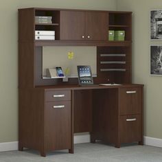 an office desk with two drawers and a bookcase