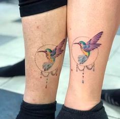 two people with tattoos on their legs and one has a hummingbird in the middle