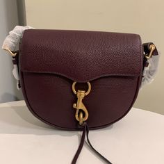 Beautiful Wine Color Leather Saddle Style Bag In New Condition Never Used. No Flaws That I Can Find. Purple Crossbody Satchel With Gold-tone Hardware, Purple Satchel With Gold-tone Hardware For Travel, Purple Shoulder Bag With Gold-tone Hardware For Everyday Use, Formal Purple Shoulder Bag With Branded Hardware, Purple Satchel With Gold-tone Hardware For Daily Use, Everyday Purple Satchel With Gold-tone Hardware, Purple Crossbody Shoulder Bag With Branded Hardware, Purple Shoulder Bag With Gold-tone Hardware For Shopping, Purple Top Handle Shoulder Bag With Gold-tone Hardware