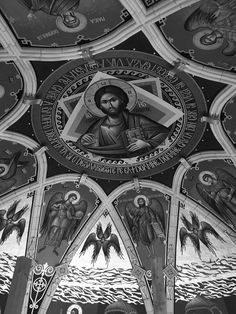 black and white photograph of the ceiling in a church with paintings on it's walls