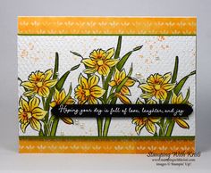 a card with yellow flowers on it and a black ribbon around the edge that says, happy birthday to all of us from laughter and joy