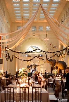 an elegantly decorated dining hall with tables and chairs