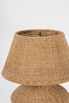 a wicker lamp shade on a white background