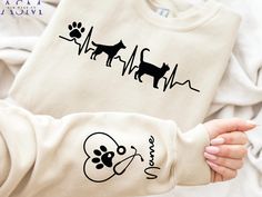 a child's shirt with an image of a dog and cat on it