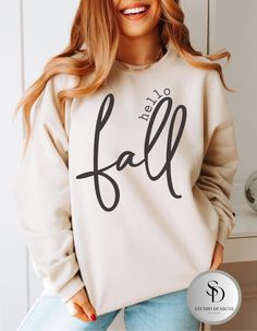 Welcome the crisp autumn air with this cozy Hello Fall Women Gildan Crewneck Sweatshirt! This soft and comfortable pullover is perfect for chilly days and everything you love about the season--pumpkin spice, falling leaves, and warm bonfires. Whether you're sipping hot cocoa or strolling through a pumpkin patch, this sweatshirt will keep you warm and stylish. Made from high-quality material, it's the perfect addition to your fall wardrobe. Material: Gildan cotton blend Fit: Unisex sizing, comfy fit Design: "Hello Fall" printed in a modern, seasonal font Occasions: Fall festivals, Thanksgiving gatherings, cozy nights at home, or casual outings Gift Ideas: Great for autumn lovers, cozy season enthusiasts, and fall fashionistas! Care instructions: * Wash items inside out in cold water. * Do n Comfortable White Fall Sweater, Comfortable White Sweater For Fall, Fall Comfortable White Top, Thanksgiving Sweatshirt Ideas, Fall White Soft-washed Sweatshirt, Cozy Soft-washed Sweater For Fall, Soft-washed White Sweatshirt For Fall, Comfortable Fall Sweater With Letter Print, Cozy White Fall Sweatshirt