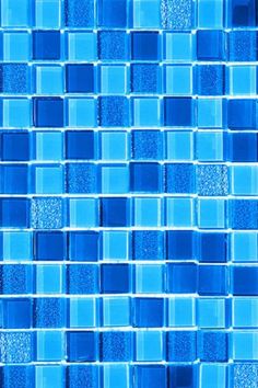 blue glass mosaic tiles are arranged in rows