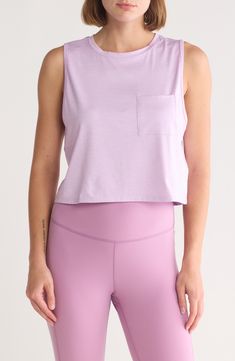 Show off those hard-earned muscles in a bicep-exposing top cut from supersoft, breathable fabric enhanced with easy-moving stretch. 19" length Crewneck Sleeveless Chest patch pocket 90% recycled polyester, 10% spandex Machine wash, tumble dry Imported Spring Athleisure Tank Top For Light Sports, Purple Sleeveless Moisture-wicking Top, Spring Sleeveless Sportswear Crop Top, Purple Sleeveless Sportswear Top, Purple Sleeveless Sporty Top, Spring Crew Neck Muscle Tee For Workout, Sporty Sleeveless Purple Top, Sporty Purple Sleeveless Top, Spring Workout Muscle Tee With Crew Neck