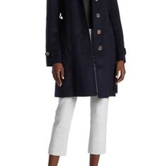 A Stylish Trench Coat Features A Belted Waist For A Figure Accentuating Silhouette During The Chilly Season - Removable Hood - Spread Collar - Long Sleeves - Front Button Closure - 2 Side Seam Pockets - Belted Waist - Back Vent - Wool Blend Construction - Approx. 36" Length (Size S) Fiber Content Shell: 60% Wool, 30% Polyester, 4% Other Fibers, 3% Nylon, 3% Acrylic Lining: 100% Polyester Care Dry Clean Fall Career Outerwear With Button Cuffs, Fall Workwear Peacoat With Button Cuffs, Fall Peacoat With Button Cuffs For Workwear, Fitted Peacoat With Button Cuffs For Work, Long Peacoat For Workwear, Long Fall Coat, Blue Winter Coat, Black Raincoat, Khaki Trench Coat