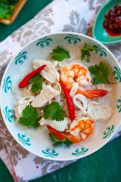 a white bowl filled with shrimp and veggies