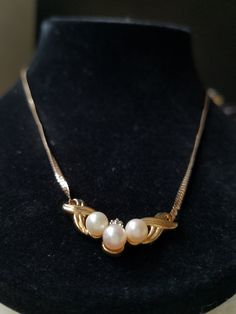 "This vintage 10K Yellow Gold bib necklace is encrusted with 3 Buttery natural round shaped Beige pearls, and 3 tiny clear diamonds. These gemstones are genuine and have been tested. This bib necklace came from an Estate Sale in Thornton, Co and the woman stated that she purchased it in the 1980's and has all original parts. She mentioned that the chains at one time had got tangled with another chain and she had to untangle that is why the chains look like that. They are not broken at all just a Vintage Round Pearl Drop Necklace, Vintage Pendant Necklace With Diamond Accents, Vintage Pearl Chain Jewelry For Anniversary, Vintage Formal Necklaces With Diamond Accents, Vintage Yellow Gold Necklace With Diamond Accents, Vintage Necklaces With Diamond Accents For Anniversary, Vintage White Necklace With Diamond Accents, Vintage Necklace With Diamond Accents For Gift, Vintage Necklace With Diamond Accents As Gift