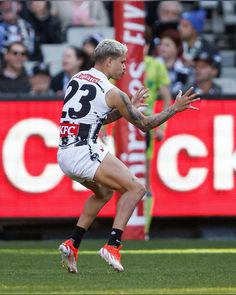 a male afl player in action on the field