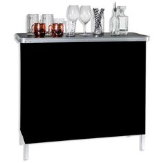 a black and silver bar with glasses on it's top, next to other drinks