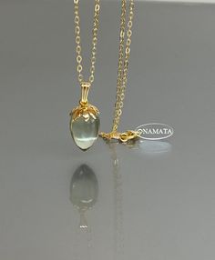 Step into a world of elegance and sophistication with our 14K gold-filled green amethyst necklace. The captivating green amethyst pendant necklace showcases the natural beauty of this exquisite gemstone. This amethyst necklace offers a simple and refined aesthetic, making it a versatile accessory for any occasion. Add a touch of elegance to your ensemble with this amethyst pendant necklace, featuring a delicate gold chain that perfectly complements the beauty of the gemstone. * Quality: Hight Qu Gift Gold Necklaces With Green Amethyst, Gift Green Amethyst Gold Necklaces, Gold Jewelry With Green Amethyst Birthstone, Luxury Green Amethyst Jewelry As Gift, Green Amethyst Gemstone Necklace, Luxury Green Amethyst Jewelry Gift, Gold Necklace With Green Amethyst Gemstone, Elegant Yellow Gold Chalcedony Necklaces, Oval Green Amethyst Gold Jewelry