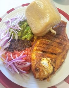 a white plate topped with meat and veggies