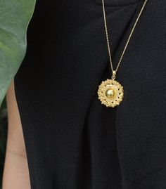 Filipiniana reimagined for the modern Filipina. Our Julia Rosita Necklace pays homage to the tambourine (or tamborin) necklaces from the Philippines' colonial past. The ornate pendant is embellished with at least 98 tiny granules! Handcrafted in gold filigree, a meticulous and rare technique perfected by the plateros o