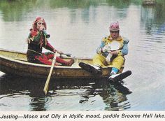 two people are in a canoe on the water