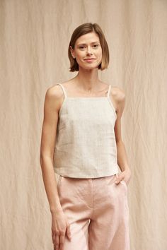 "Bring charm to your everyday outfits with our SKYLAR top. FABRIC: 100% Washed Lithuanian Linen COLOR: Please choose the desired color from the side menu. STYLE: Linen crop top with spaghetti straps. SIZE CHART (body measurements): 2 US/ 6 AU/ 34 EU: Bust 31.5\" (80 cm) , Waist 23\" (59 cm), Hips 35\" (88 cm) 4 US/ 8 AU/ 36 EU: Bust 33\" (84 cm) , Waist 25\" (63,5 cm), Hips 36\" (92 cm) 6 US/ 10 AU/ 38 EU: Bust 35\" (88 cm) , Waist 26,5\" (67,5 cm), Hips 38\" (96 cm) 8 US/ 12 AU/ 40 EU: Bust 36\ Linen Spaghetti Strap Top, Casual Summer Camisole With Built-in Bra, Summer Cropped Camisole With Adjustable Straps, Beige Linen Tank Top For Summer, Beige Crop Top With Built-in Bra For Summer, Cropped Camisole For Summer, Beige Linen Tank Top For Beach, Chic Linen Cami Tank Top, Fitted Linen Casual Crop Top