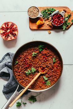 a pot filled with food next to other ingredients