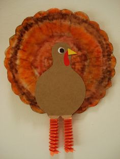 a paper turkey is hanging on the wall