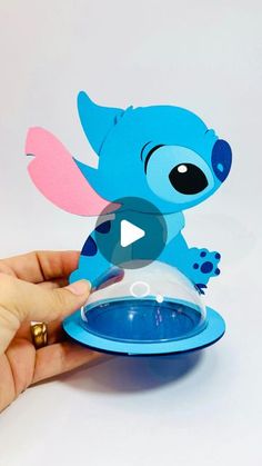 someone is holding up a paper cut out of stitchy the stitcher from stitch