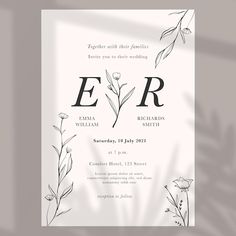 an elegant wedding card with flowers and leaves