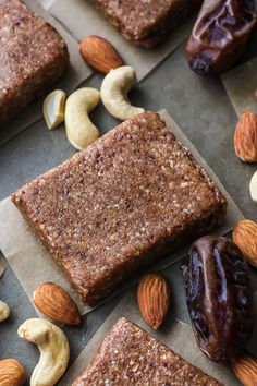 nuts, almonds, and bars are on the table for this healthy snack to be eaten