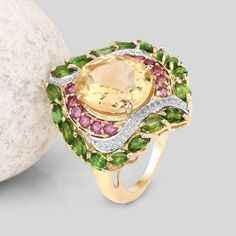 Flaunt yourself with this citrine, rhodolite garnet & chrome diopside statement ring. The natural gemstones have a combined weight of 6.11 carats and are set in .925 sterling silver with rhodium plating. The soft orange hue of this ring adds a pop of color to any look! The understated design and vibrant stones make this ring perfect for every occasion. Oval Green Citrine Rings, Chrome Diopside Ring, Multi Gemstone Bracelet, Multi Gemstone Ring, Soft Orange