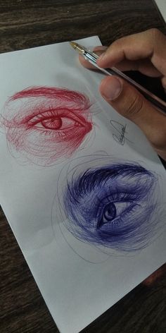 someone is drawing an eye on paper with colored pencils and watercolor pens in front of them