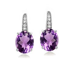 Accentuate your ensemble with these sparkling amethyst earrings. They feature genuine amethyst gemstones, accented by 2 genuine diamonds. Earrings are crafted entirely of sterling silver and are secured by leverbacks. Total gem weight 4.7ct, total diamond weight .02ct. Product Details Metal Type sterling-silver Metal Stamp 925-sterling Weight 3.5GR Length 19MM Width 8MM Back Finding lever-back Stone Details Gem Type amethyst Number of Stones 2 Stone Shape oval-shape Total Weight 4.7 Setting Type Quinceañera Ideas, Nyc Jewelry, Queen Fashion, Yellow Gemstones, Africa Map, Bagan, Leverback Earrings, Amethyst Jewelry, Amethyst Purple