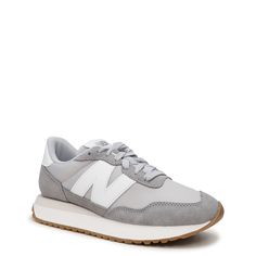 Versatile and trendy, these women's New Balance 237 marblehead/raincloud (grey) running shoes are a modern uptake on 70s running heritage design. Featuring a streamlined silhouette with unbacked suede and mesh upper, these athleisure sneakers have an oversized N branding on the side for a modern look, extended midsole length, gator inspired foxing, asymmetrical rubber tip wrap and mudguard for extra protection. An exposed foam tongue and EVA midsole provide lightweight comfort while a large scal Gray Running Shoes With Translucent Outsole For Jogging, Gray Leather Running Shoes With Translucent Outsole, Gray Sneakers With Contrast Sole For Jogging, Gray Sneakers For Jogging With Contrast Sole, Gray Athleisure Running Shoes With Translucent Outsole, Gray Running Shoes With Contrast Sole For Jogging, Sporty Gray Running Shoes With Contrast Sole, Gray Athleisure Running Shoes With Waffle Outsoles, Gray Leather Athleisure Sneakers