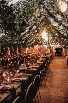 an indoor wedding venue with tables and chairs