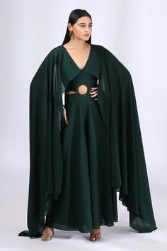 Dark green double georgette jumpsuit with a ring cut-out in the bodice and cape sleeves.
Component: 1
Neckline: V neck
Sleeve Type: Cape
Fabric: Double Georgette
Color: Green
Other Details: 
Ring cut-out detailing
Cape sleeves
Occasion: Party - Aza Fashions Georgette Jumpsuit, Green Cape, Jumpsuit For Women, Green Jumpsuit, Jumpsuit Online, Cape Sleeves, Jumpsuit With Sleeves, Fantasy Fashion, Sleeves Pattern