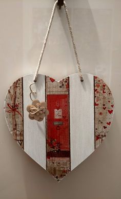 a wooden heart hanging on a wall