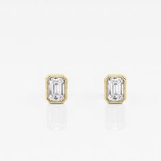 Emerald cut lab grown diamond stud earrings. A popular European style, these diamonds are wrapped in a high polished bezel setting. Timeless Anniversary Earrings With Bezel Setting, Timeless Bezel Set Earrings For Anniversary, Classic White Diamond Earrings With Bezel Setting, Formal Bezel-set Diamond Earrings Fine Jewelry, Formal Fine Jewelry Diamond Earrings With Bezel Setting, Formal Diamond Earrings With Bezel Setting, Formal White Gold Diamond Earrings With Bezel Setting, Gold Diamond Earrings With Bezel Setting For Anniversary, Anniversary Bezel Set Diamond Earrings