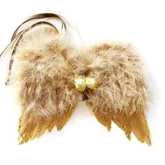 a pair of furry angel wings with gold sequins