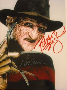 an autographed image of a man in a hat holding a knife and fork