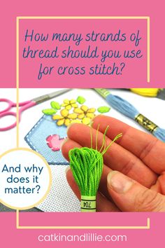 a hand holding a green thread with the words how many strands of thread should you use for cross stitch?