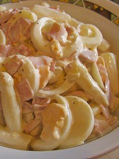 pasta with ham and cheese in a bowl