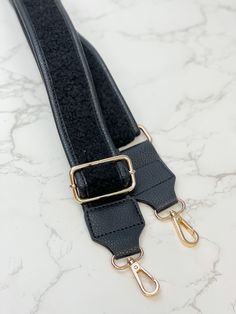 Upgrade from your favorite flannel with cabin-inspired vegan sherpa straps. Universal clips make it easy to match with the Camden Mini Messenger or any other bag for a cozy look with feel-good function. 100% vegan leather + sherpa Adjustable length (55” fully extended) Shoulder-friendly 2" width Branded goldtone hardware with swivel snap clips Versatile Black Bag With Detachable Strap, Black Everyday Bag Strap With Adjustable Straps, Black Logo Strap For Everyday Bags, Black Adjustable Bag Strap For Everyday Use, Black Adjustable Straps Bag Strap For Everyday Use, Adjustable Black Shoulder Strap For Everyday, Black Detachable Bag Strap Fashion Accessory, Everyday Black Bag Strap With Logo, Black Bag Strap With Adjustable Straps