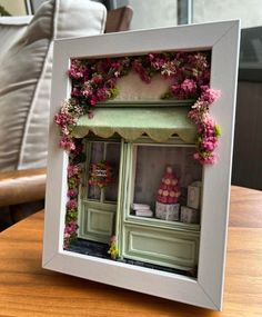 an image of a doll house made out of flowers