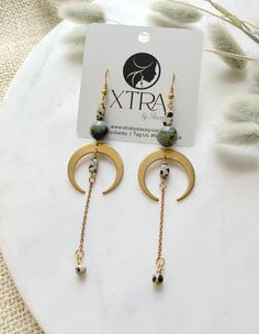 These are extra long, brass crescent arch earrings featuring 10mm African Turquoise beads, rectangular Dalmatian Jasper beads, and brass cable chain.These unique boho earrings hang approximately 4.1" inches from the lobe. The earwire is 18k gold plated and should be suitable if you have a metal allergy or sensitivity.These earrings are lightweight and should be comfortable for all day wear. Moon Arch, Arch Earrings, Dalmatian Jasper, African Turquoise, Jasper Beads, Turquoise Beads, Dalmatian, Long Earrings, Boho Earrings