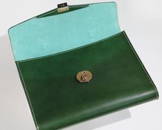 Mens leather briefcase in a classic yet modern style, to treasure for years to come. Brass lock closure, top handle, envelope style flap.Elegant, rich green Italian Buttero leather exterior, suede lined interior.Luxury designer brand quality, handmade in the US with the finest materials sourced from Italy and France.Hand stitched and hand painted edges.Buttero leather has a smooth finish with a slight sheen, and will patina beautifully with use and time, creating a bag unique to you and your lif Men's Leather Briefcase, Mens Briefcase, Leather Goodies, Leather Mouse, Leather Mouse Pad, Interior Luxury, Leather Briefcase Men, Tech Cases, Briefcase For Men