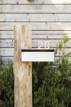 a wooden post with the number 29 on it